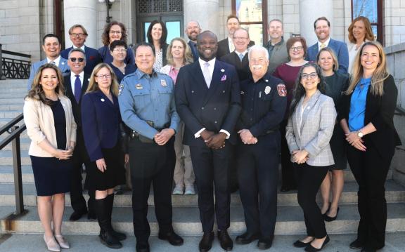 (left-right; top row: Peter Wysocki, Charae McDaniel, Mary Weeks, Jariah Walker, Travis Easton, Henry Martin, Andrew Notbohm, Jamie Fabos; middle: Ryan Trujillo, Greg Phillips, Wynetta Massey, Gayle Sturdivant, HayDen Kane, Sarah Johnson Vanessa Zink; front row: Jessie Kimber, Britty Haley, Adrian Vasquez, Mayor Yemi Mobolade, Randy Royal, Myra Romero, Katie Sunderlin)