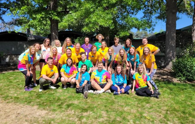 large group of people in brightly colored shirts