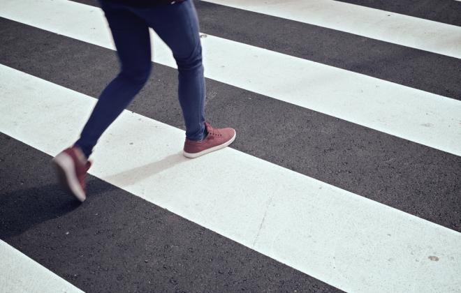 person walking in a crosswalk