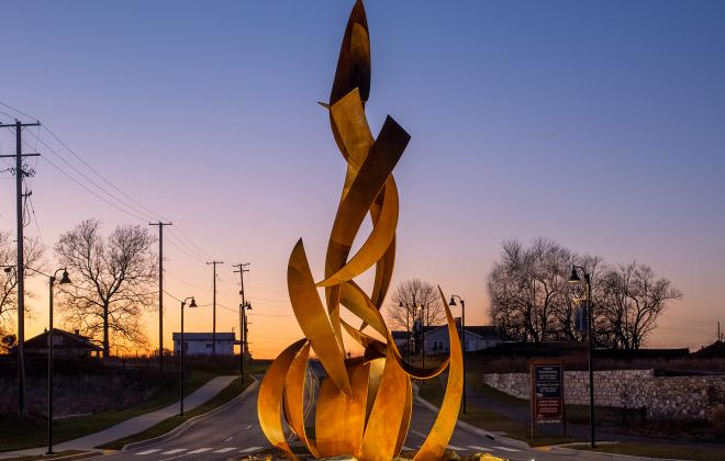 a large metal sculpture of a campfire