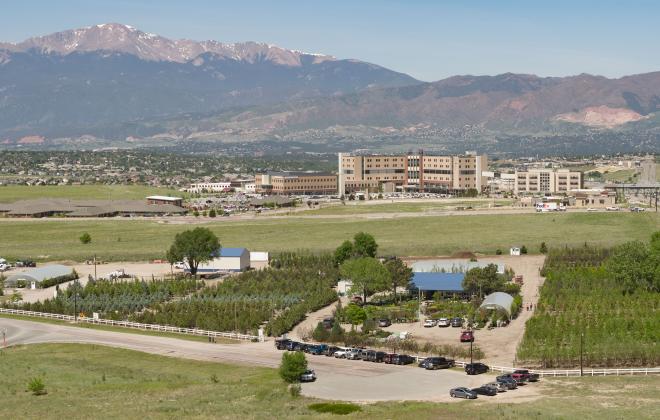 aerial view of tree nursery with pikes peak in the background