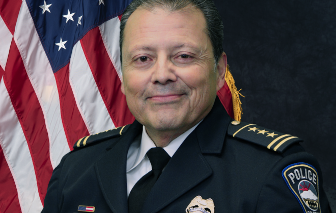 official photo of interim chief vasquez in his dress blues.